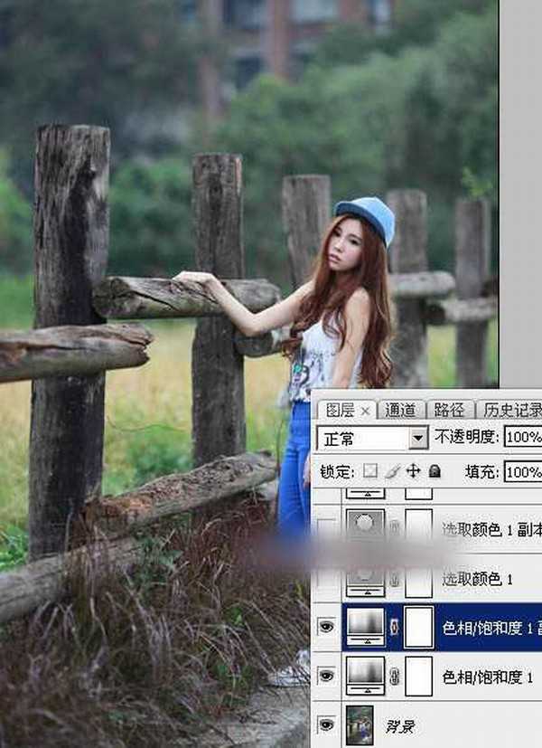 Photoshop为木桩边的美女人物加上高对比蓝黄色效果教程